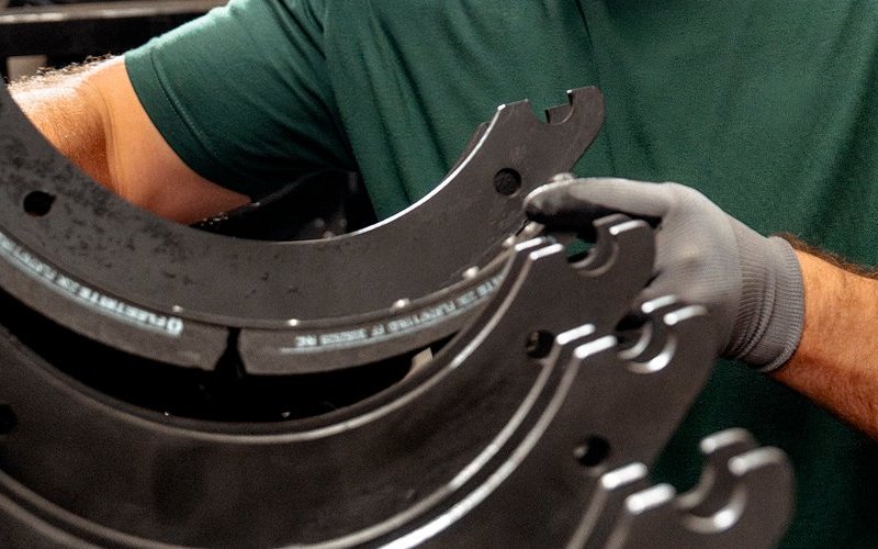 Parts specialist handling Fleetrite brake shoes